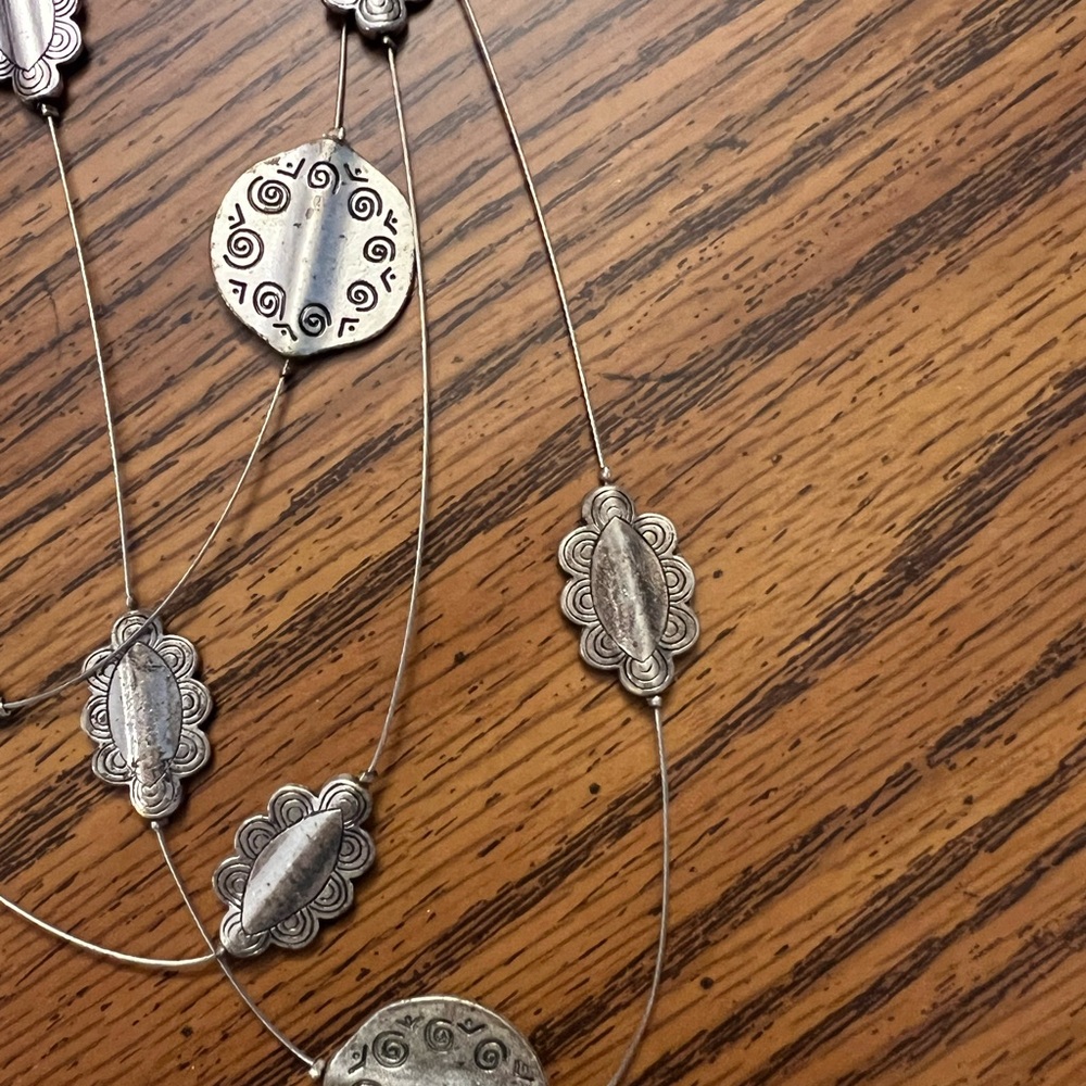 Silver Necklace with Textured Pendants and Leaf Accents - Picture 4 of 4